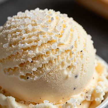 Macro shot of textured sea salt vanilla ice cream with visible vanilla bean specks.
