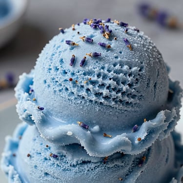 Soft blue lavender ice cream with tiny organic lavender buds infused into the cream.