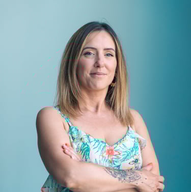 a woman with tattoos on her arms and arms crossed