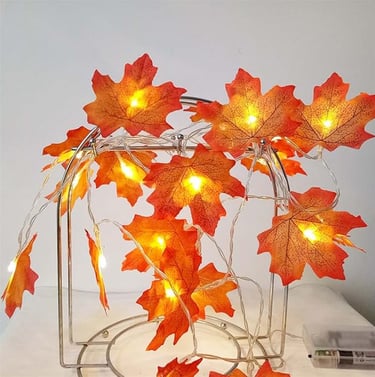 Battery-operated maple leaf string lights with 20 warm orange LEDs on a 9.8ft copper wire,