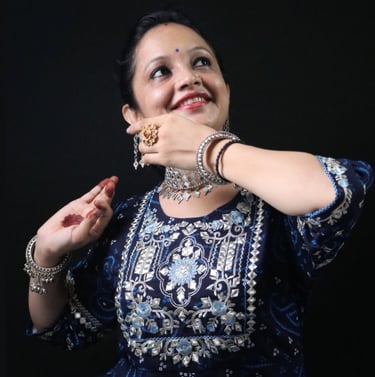 a woman demonstrating a graceful Kathak pose. Ms. Swati Sharma, Kathak Expert from Thirkan
