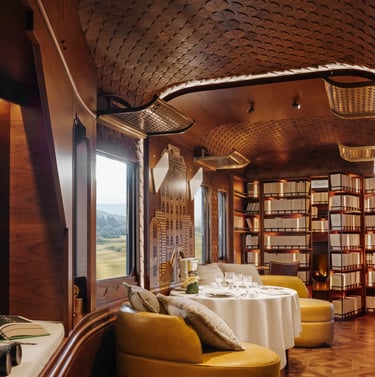 Britannic Explorer train L’Observatoire lounge with marquetry design and private dining area.