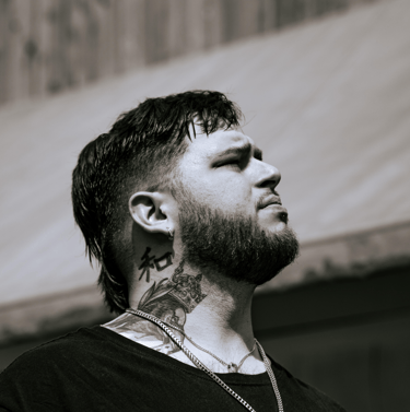 Savage Banks looking right toward the horizon, shoulders-up portrait.