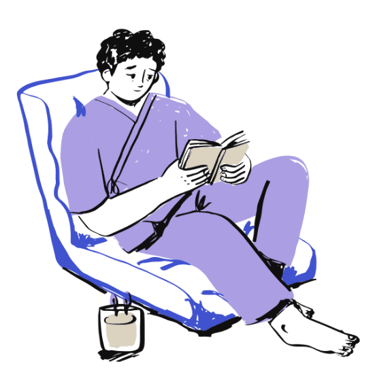 A man in a purple outfit sitting and reading looking rather sad