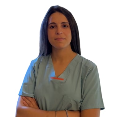 a woman in scrubs and scrubs standing in front of a white wall