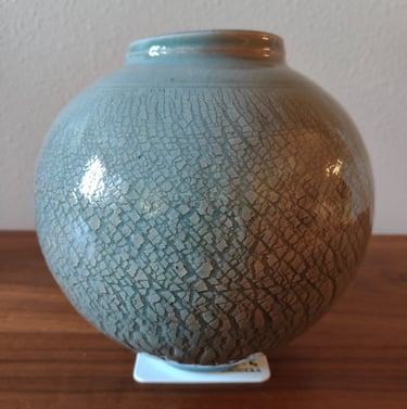 finished wheel-thrown moon jar with sodium silicate crack pattern and celadon glaze
