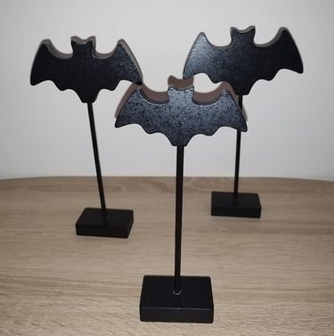 Three black wooden bat figurines on stakes with bases, Gothic Halloween tabletop decoration