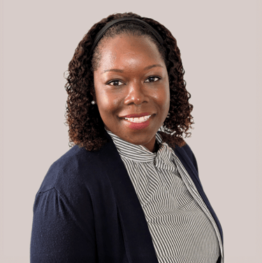 a woman in a black jacket and a white shirt