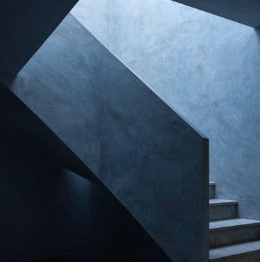 Architectural detail of a minimalist staircase in a Portuguese studio, sharp angles, interplay of light and shadow on Slate Blue surfaces. Abstract conceptual photography, elegant and refined style.