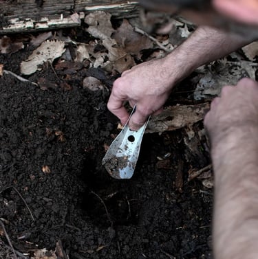 man digging with boglerco trowel