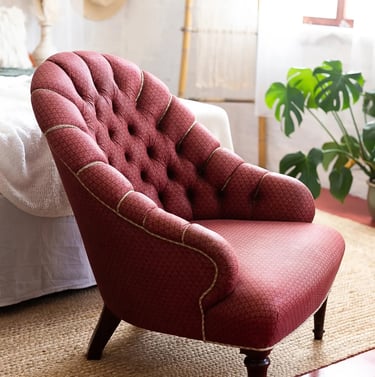 a chair with a red chair and a hat on it