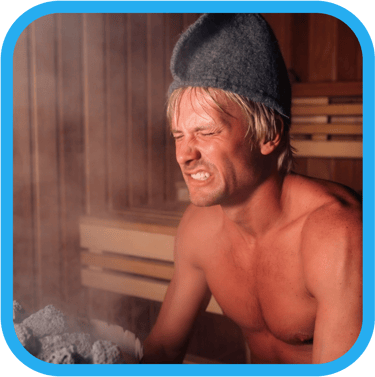 a man in a sauna with a sauna hat grimacing