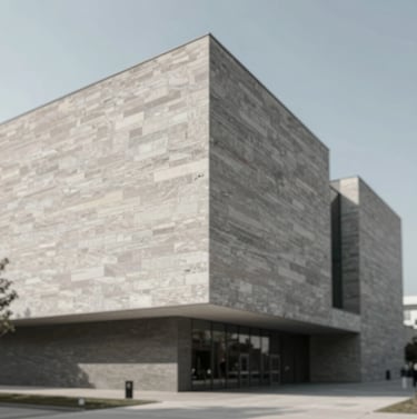 Exterior facade of a modern museum building at noon, showing textured stone surfaces and sharp shadow lines, emphasizing professional architectural photography and #D9D2C7 tones.