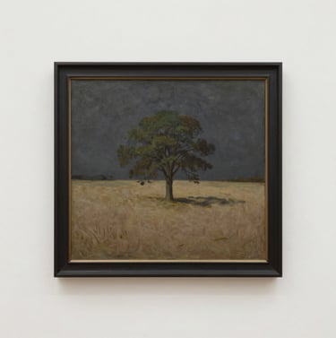 A framed oil painting hanging on a clean, soft off-white gallery wall. The painting depicts a solitary tree in a warm taupe field under a dark charcoal sky. Minimalist and elegant composition.