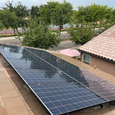 Freshly cleaned solar panels on a Fresno home by Spartan Home Services
