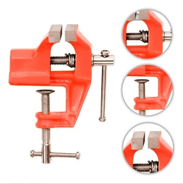 Red metal bench vise tool with clamp base and adjustable jaws for woodworking and jewelry tasks.