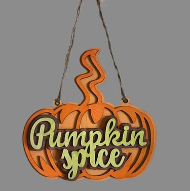 Pumpkin-shaped wooden hanging sign for home decor.