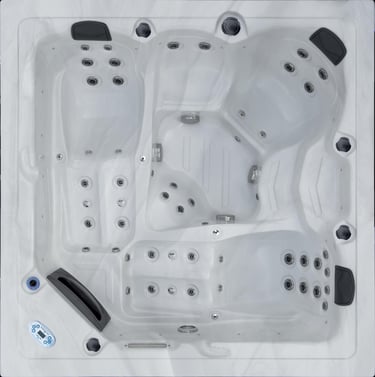 a hot tub with blue water flowing down the side of it