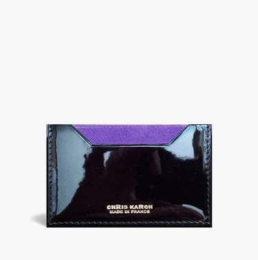 Elegant black patent leather card holder with a purple suede lining by Chris Karch.
