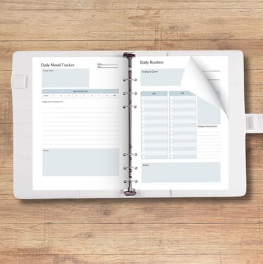 A white A5 planner binder with planner inserts inside.
