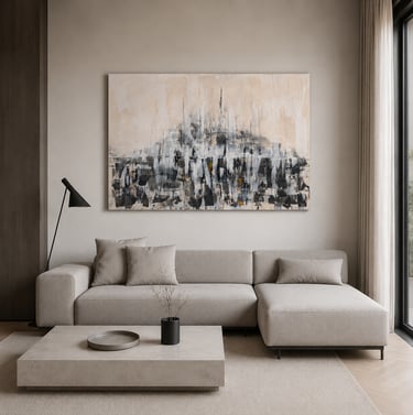 Modern minimalist living room with a beige sectional sofa and large abstract wall art.