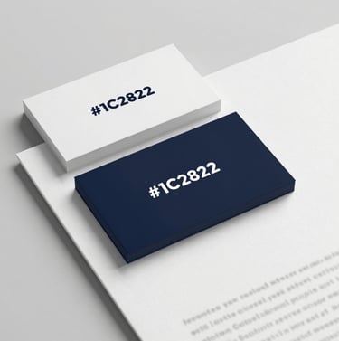 A professional mockup of physical brand collateral, including a business card and a letterhead. The design is understated and minimalist, using high-quality paper texture and the dark brand color #1C2826 for the logo. Soft shadows create depth.