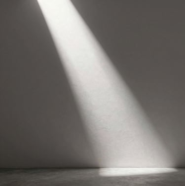 A minimalist studio scene with a single shaft of light hitting a textured wall, evoking the mood of upcoming artistic projects, palette of #1F1E1C, #4C4A48 and #F5F2EF.