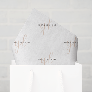 a white bag with white tissue paper and a white bag