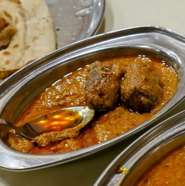 Traditional Gulab Jamun ki Sabji from Jodhpur, a unique Rajasthani curry blending sweet and spicy flavors.