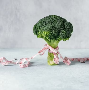 broccoli in primo piano con un nastro rosa a indicare la lotta silenziosa vegana di proveg 