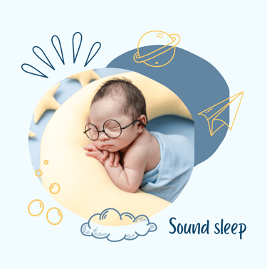 a baby sleeping on a moon shaped pillow