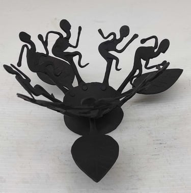 "Handcrafted tribal iron oil lamp with dancing figures–front view–for international delivery"
