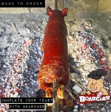 cebu lechon on a bed of charcoals
