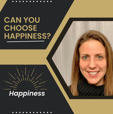 Amy McArdle with a black scarf and a black sweater with a gold and white background