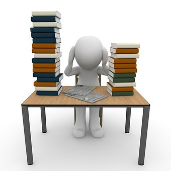 student bending over a pile of books vector