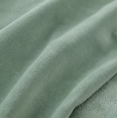 Close-up of MIANS SOLUTIONS brushed microfiber fabric showing the soft napped texture, durable weave