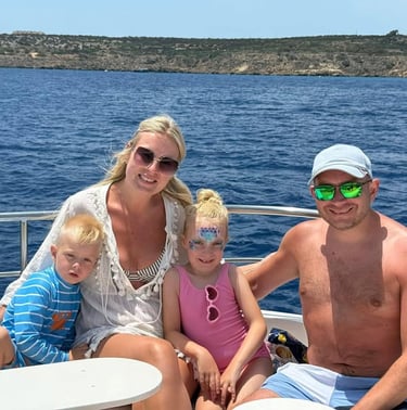 Happy family enjoying a family boat cruise in Cyprus