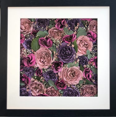 a flower wall style preserved wedding bouquet of bright pins and soft purples in a frame