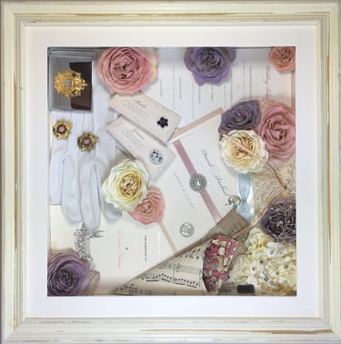memory box full of preserved wedding flowers, gloves, invitations, music sheets and other keepsakes