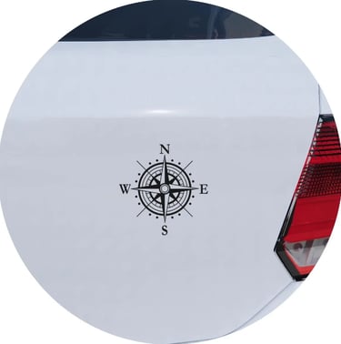 Black nautical compass rose vinyl decal applied to the rear of a white car.