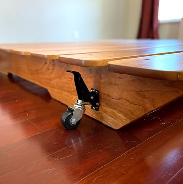 a wooden table with wheels and wheels on it