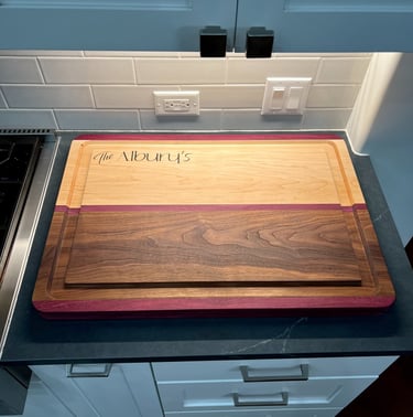 a cutting board with a wooden cutting board on top of a counter