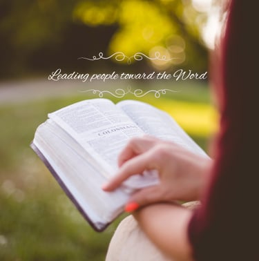 A woman reading the Bible - Leading people toward the word