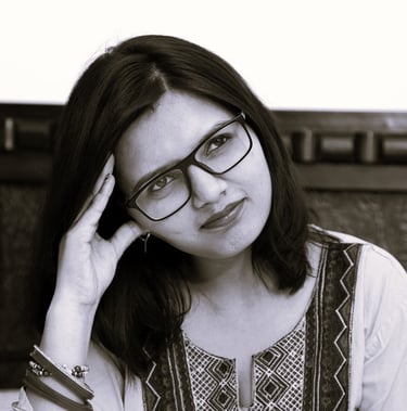 a woman in glasses gazing to the distance