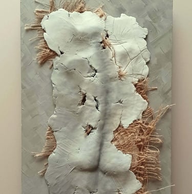 A relief sculpture of a fragmented female (rear view) with protruding hessian, painted cool browns