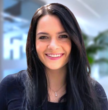 a woman with long hair and a black top