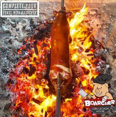 cebu lechon being roasted on a bed of charcoals