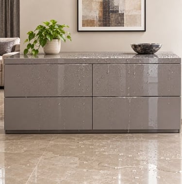 Water-resistant modern grey dresser with high-gloss finish showing water droplets on the surface.