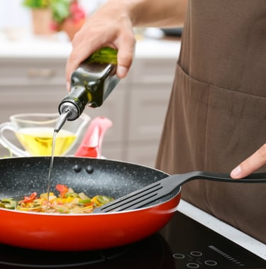 a person cooking a meal in a kitchen
