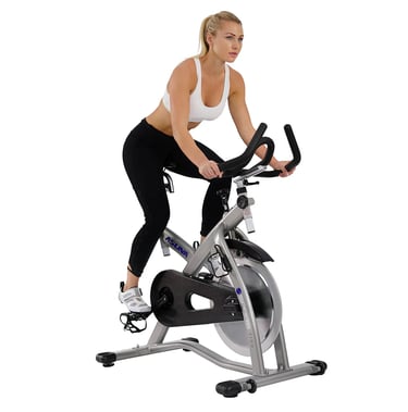 women riding exercise bike